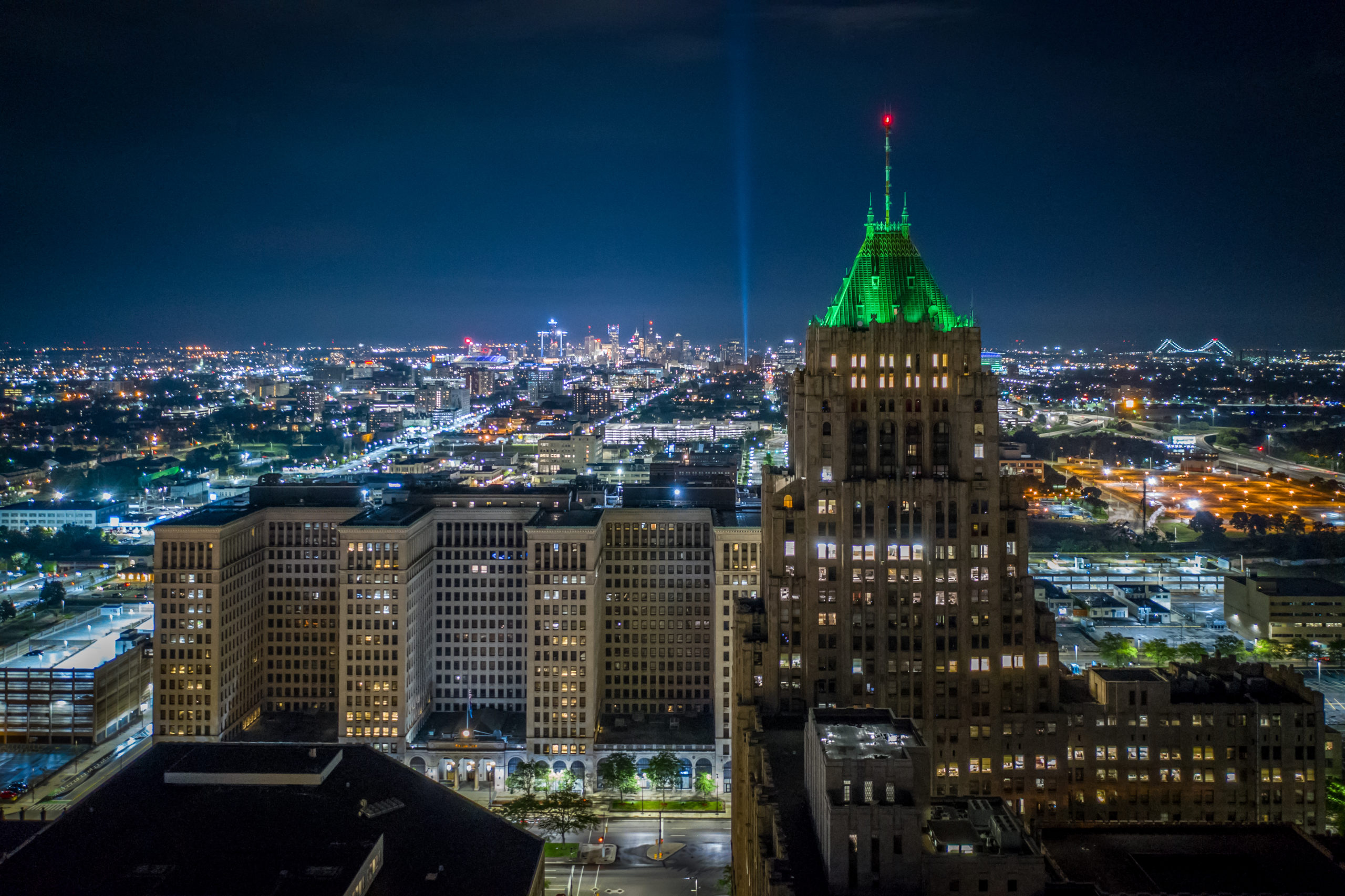 Fisher Building at night with green tower